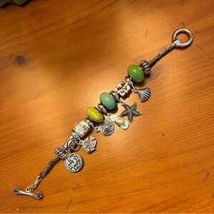 Pandora style sterling silver charm bracelet 
(With 6 beads, 2 ends, 6 charms)